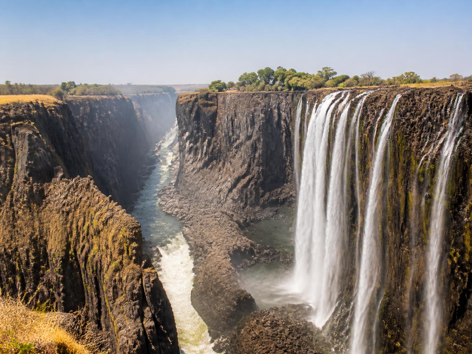 Victoria Falls in low water season with exposed basalt cliffs